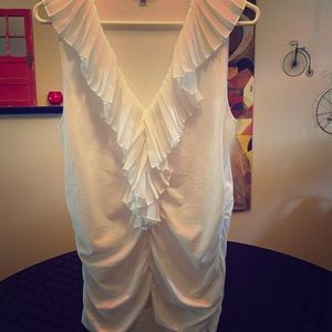 Cabi white sleeveless blouse with ruffle.